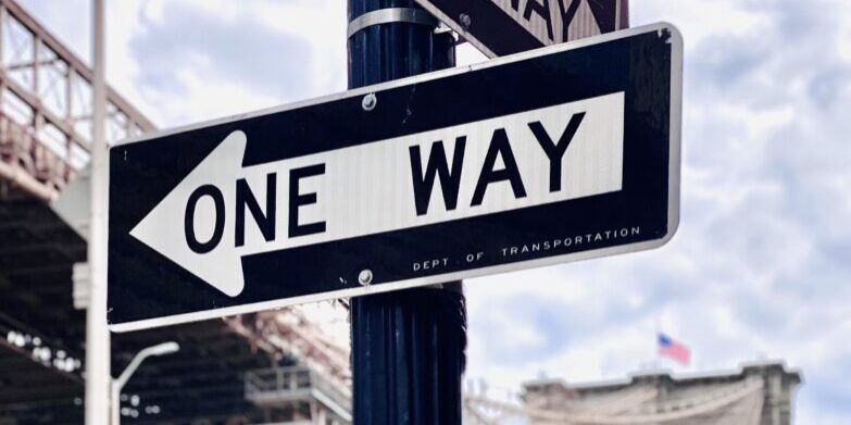 low-angle-view-road-sign-against-sky